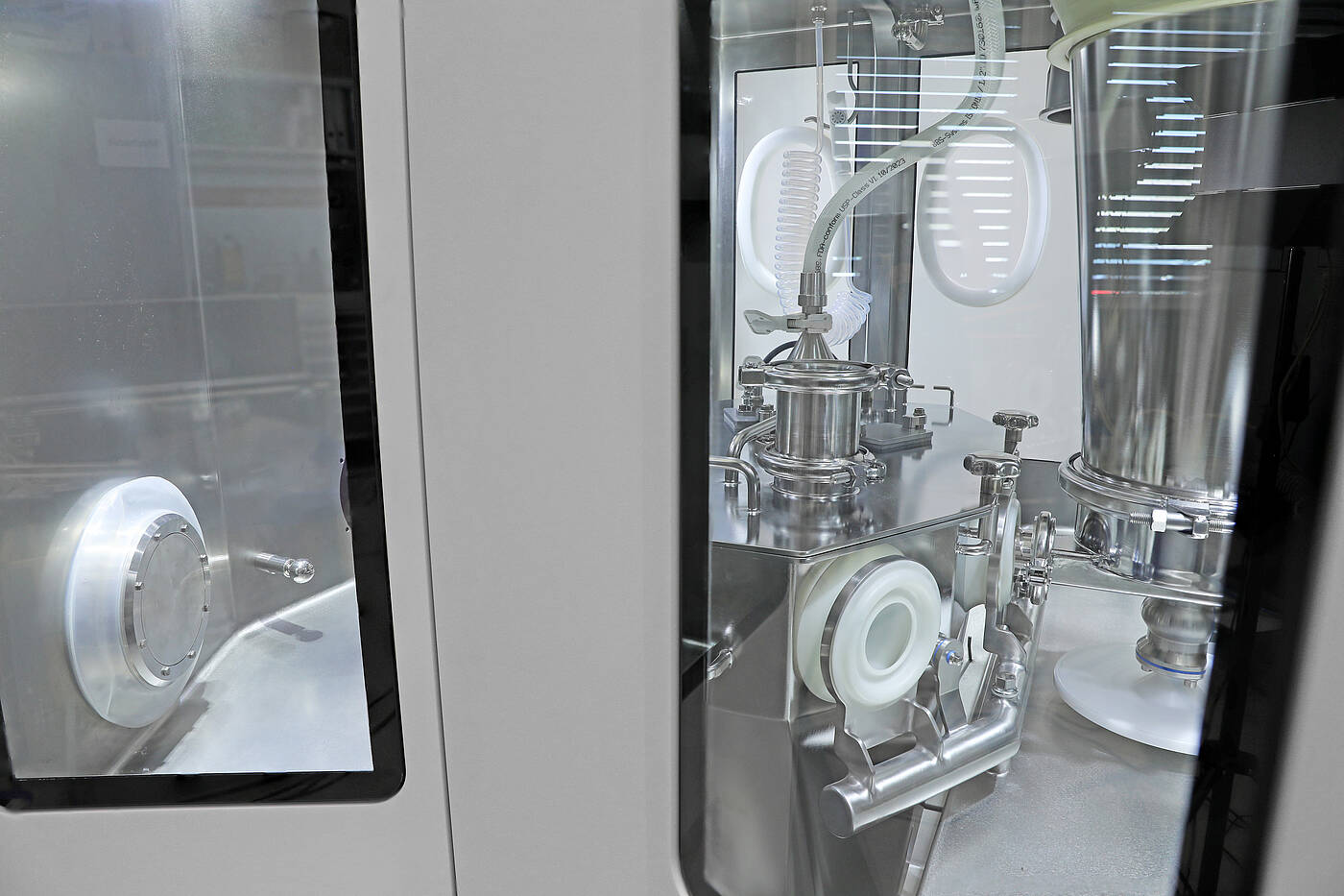 Contained continuous manufacturing system